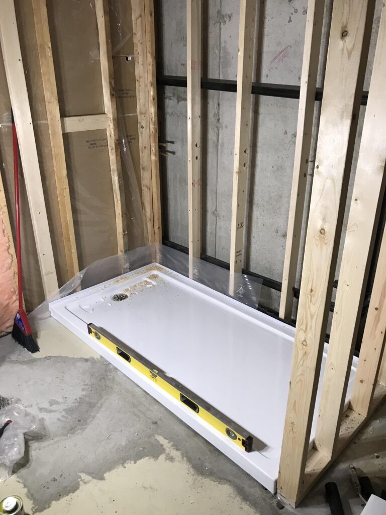 How to Install a Shower Base on Concrete Floor